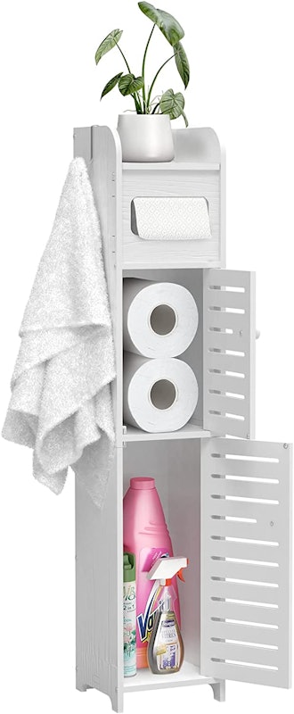 bathroom storage cabinet with toilet paper and other items inside