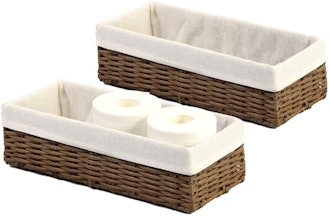 two bathroom storage baskets, one with toilet paper in it