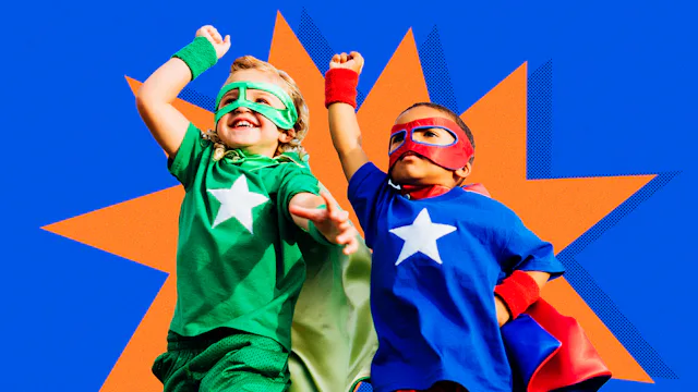 Two boys wearing superhero costumes