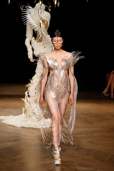 A model walks the runway during the Iris Van Herpen Haute Couture Fall Winter 2022 2023 show as part...