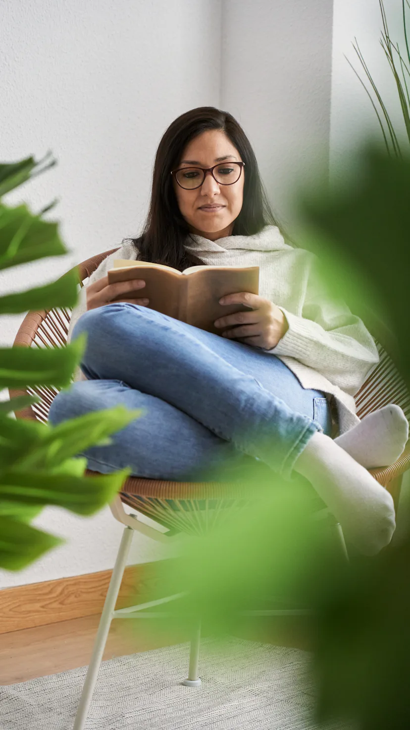 Woman reading book.