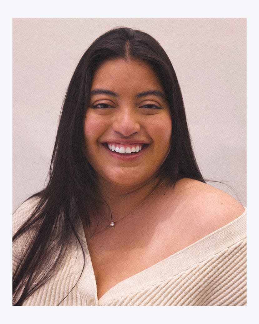 Keyla Monterroso Mejia wearing a shirt with an open shoulder, smiling