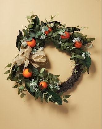HomeGoods artificial tangerine and vine half wreath