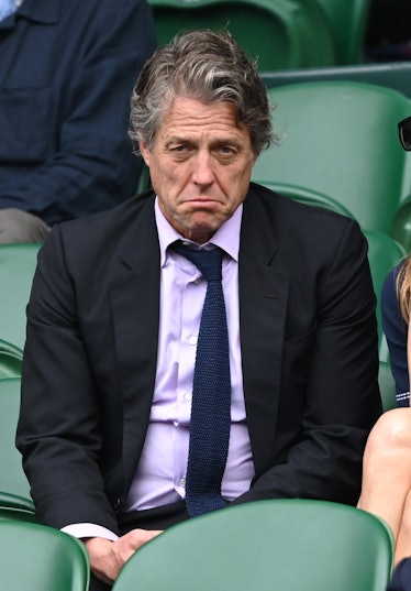 Hugh Grant looking miserable at Wimbledon