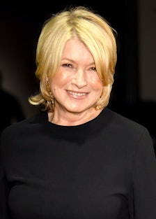 Martha Stewart wearing a black top and grinning