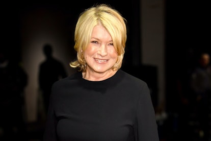 Martha Stewart wearing a black top and grinning