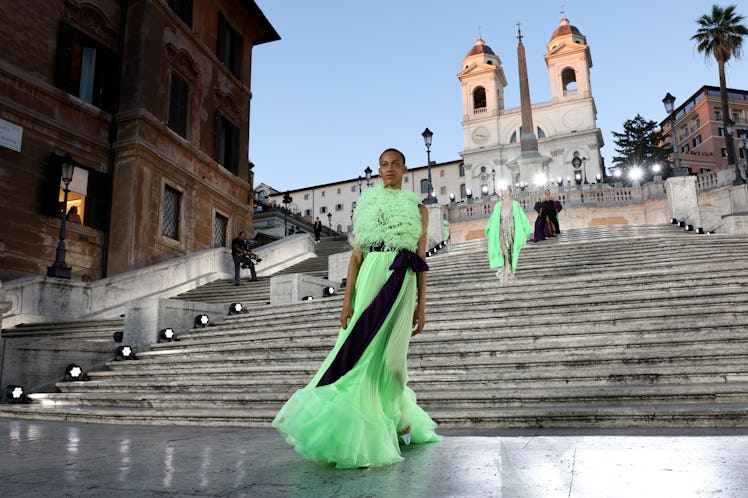 A model walking on the runway at the Valentino haute couture fall/winter 22/23 fashion show in a gre...