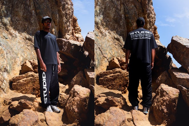 Supervsn Studios Black outfit with white text, T-shirt, trainers and a hat.
