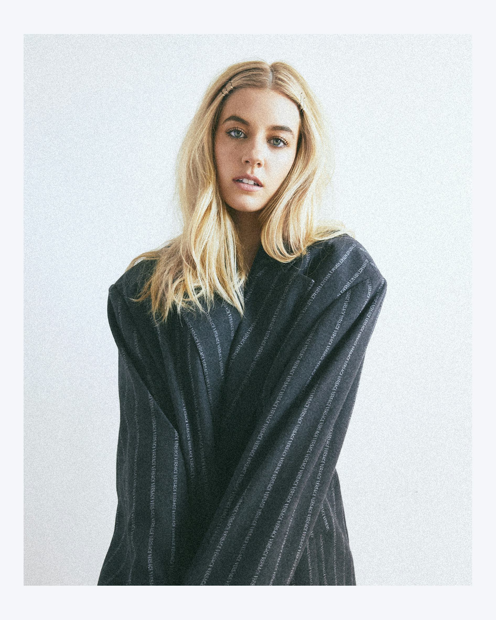 Mallory Bechtel wearing a striped oversized blazer with her hair down