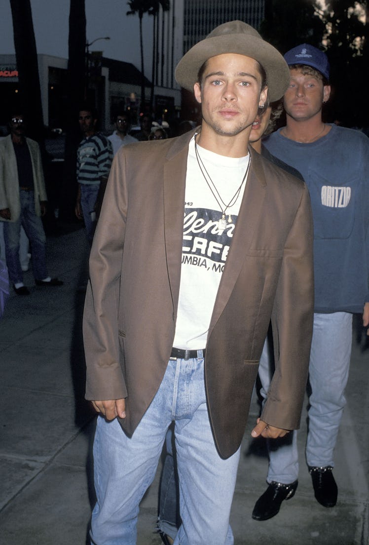 Brad Pitt wearing a brown hat and matching brown blazer