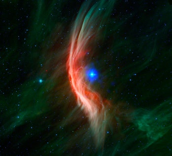 A bright blue star shines at the center of the image, and the color represents its incredibly-hot te...
