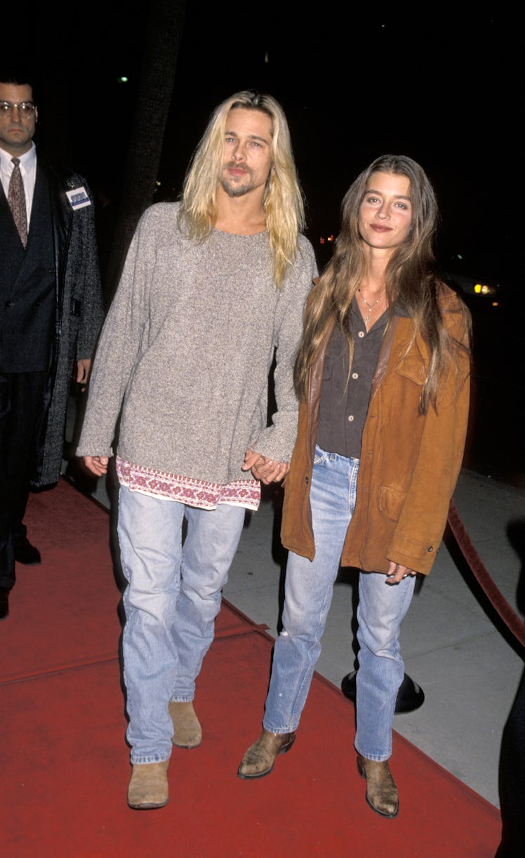 A long-haired blonde Brad Pitt and Jitka Poheldek on a red carpet