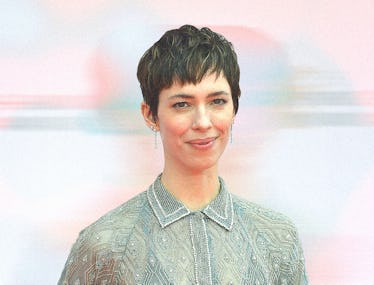 A photo of Rebecca Hall wearing a seafoam dress.