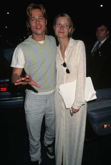 Brad Pitt wearing a sweater vest next to Gwyneth Paltrow