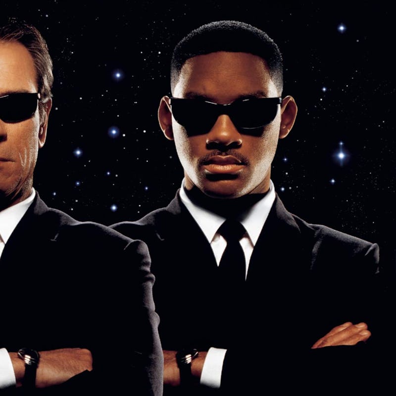 A poster from Men in Black sci-fi movie with Tommy Lee Jones and Will Smith