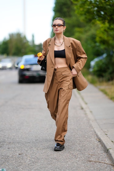 A guest  outside Rabens Saloner, during Copenhagen Fashion Week Spring/Summer 2023