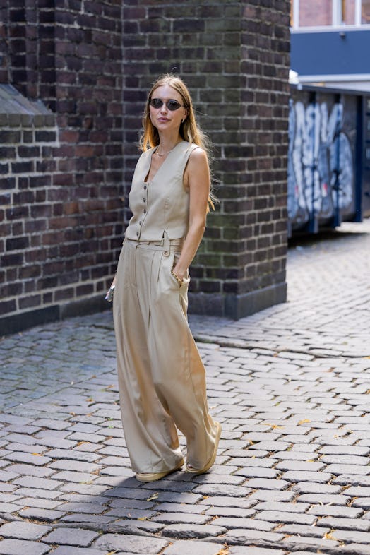 Pernille Teisbaek seen wearing beige vest, pants outside A. Roege Hove during Copenhagen Fashion Wee...