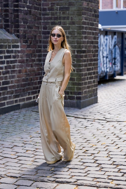 During Copenhagen Fashion Week, Pernille Tesbeck was spotted wearing a beige vest, trousers outside of A.Roge Hove...