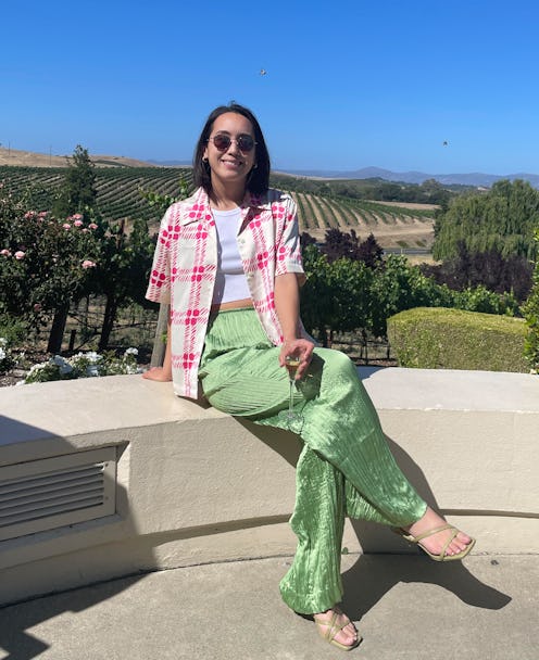 Marina Liao poses in mint silk pants collared gingham shirt layered over a white top after getting h...