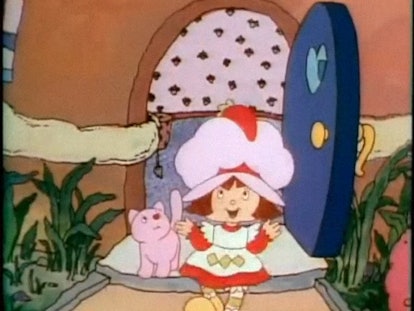 Strawberry Shortcake starts the day with her cat. 