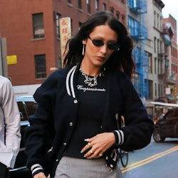 bella hadid wearing a bomber jacket and skirt in nyc on aug 9, 2022