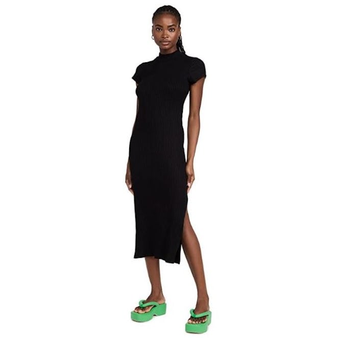 This T-shirt dress features a clingy silhouette, side slits, and is made of a soft viscose blend
