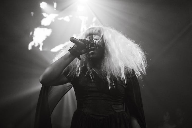 Black and white photo of Backxwash rapper during her performance