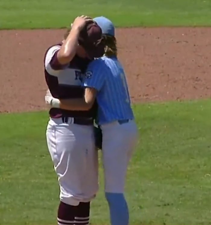 A pitcher was comforted after accidentally hitting a batter.