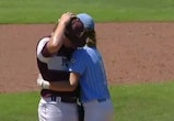 A pitcher was comforted after accidentally hitting a batter.