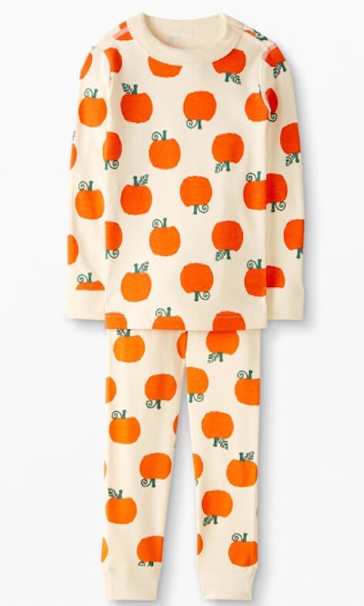 Kids' Halloween pajamas in a classic pumpkin print are a must for fall.