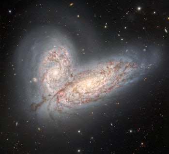 color image of two merging galaxies in space