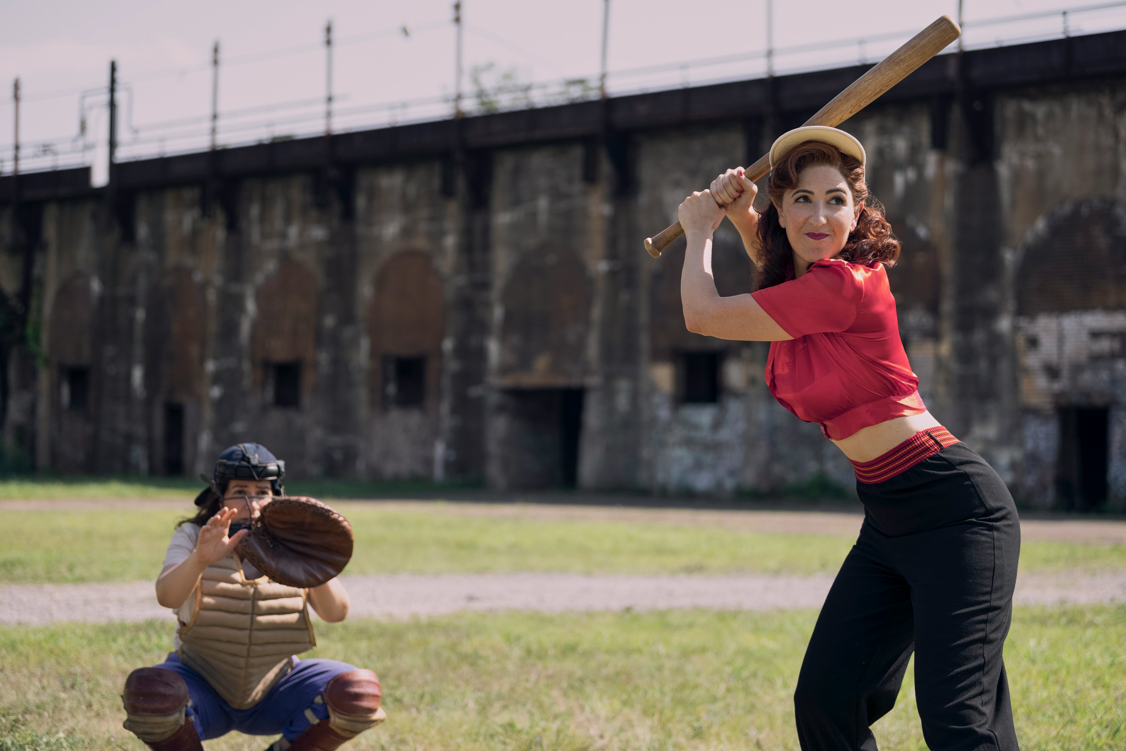 D&rsquo;Arcy Carden as Greta practices her swing in A League of Their Own.