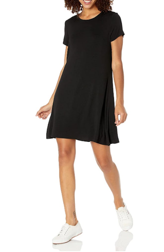 This A-line T-shirt dress has a knee-length hem, short sleeves, and a scoop neck
