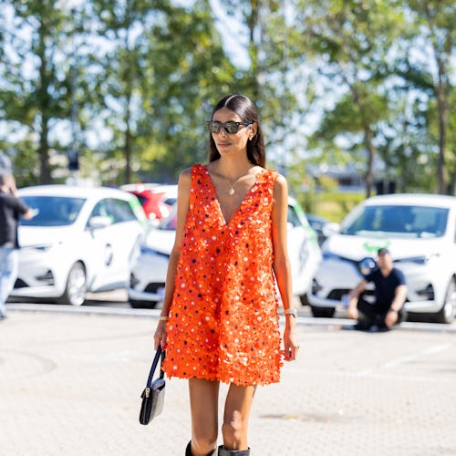 Babba Rivera seen wearing orange glitter dress in Copenhagen Fashion Week