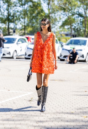 Babba Rivera seen wearing orange glitter dress in Copenhagen Fashion Week