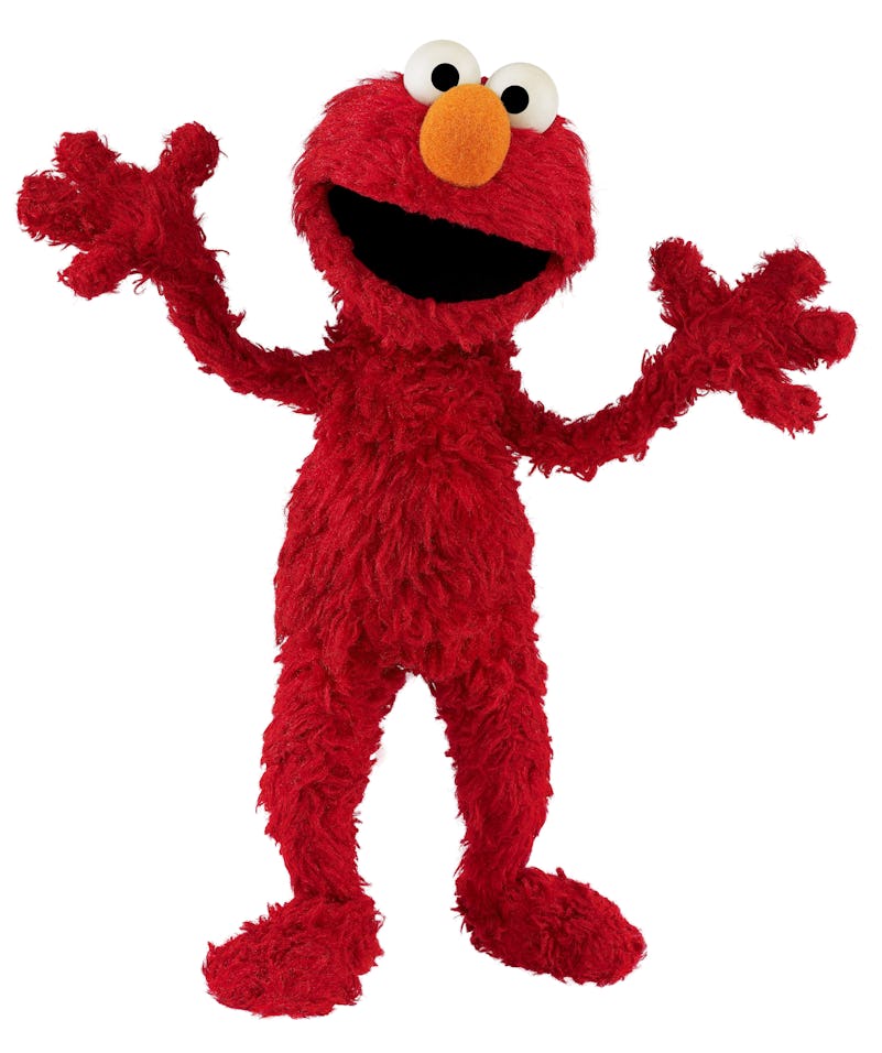 A photo of Elmo standing against a white background in an article about what kind of monster is Elmo...