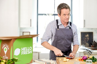 Neil Patrick Harris prepares dinner in his kitchen.
