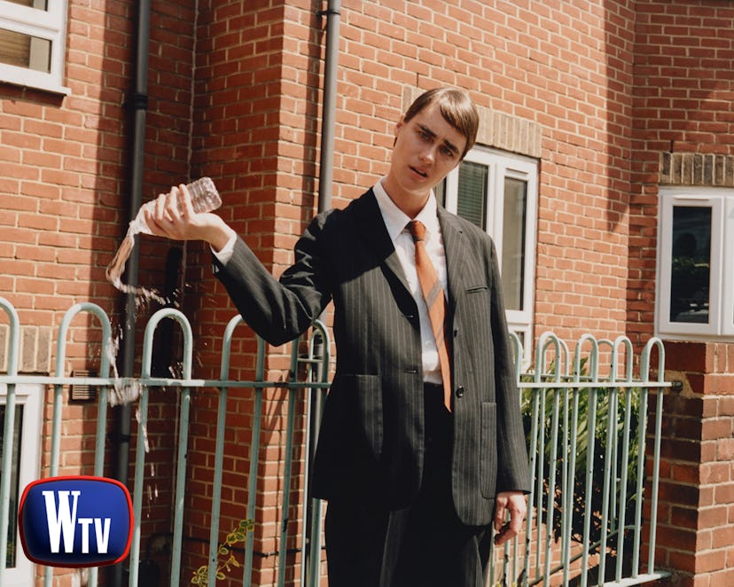 Mackenzie Davis as Stath from ‘Stath Lets Flats.’ Davis wears Margaret Howell suit, shirt, and tie.