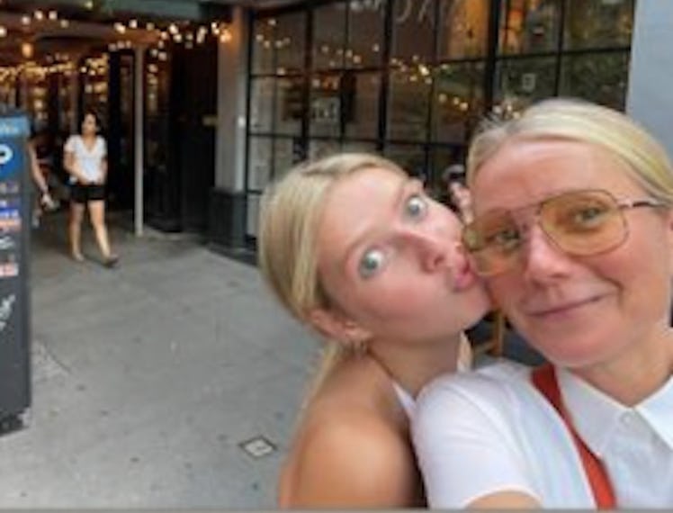 Gwyneth Paltrow posing with her daughter Apple Martin in front of Via Carota restaurant.