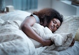 Stock image of woman in bed
