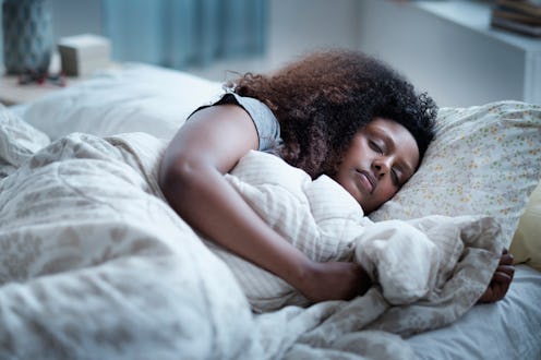 Stock image of woman in bed