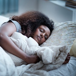 Stock image of woman in bed