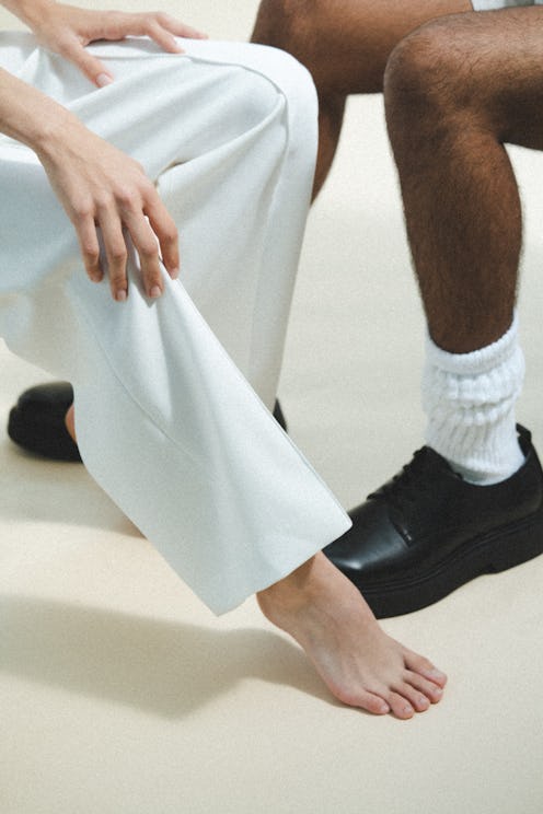 A woman and a man with bare feet.