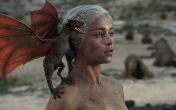 A baby Drogon roars on the shoulder of Daenerys Targaryen (Emilia Clarke) in "Fire and Blood."