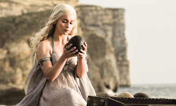 Daenerys Targaryen (Emilia Clarke) holds a dragon egg in “Winter is Coming.”