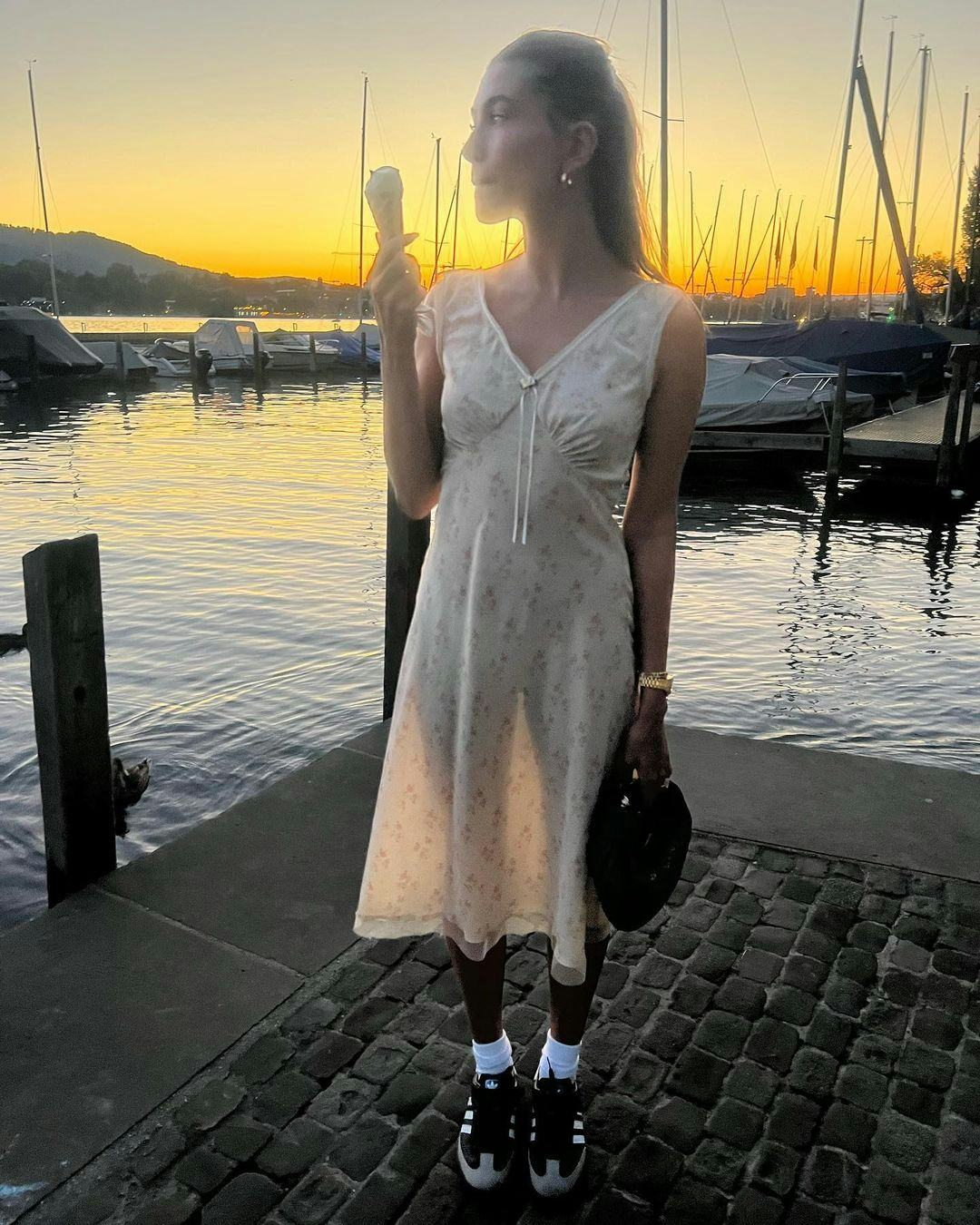 hailey bieber wearing a vintage slip dress with adidas samba sneakers and white socks