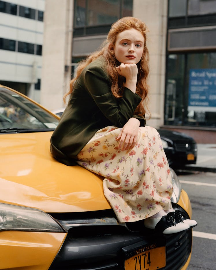 Sadie Sink as Elaine Benes in ‘Seinfeld.’ Sink wears The Opportunity Shop dress and blazer.