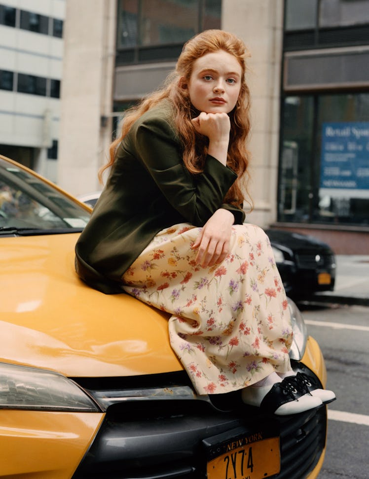 Sadie Sink as Elaine Benes in ‘Seinfeld.’ Sink wears The Opportunity Shop dress and blazer.