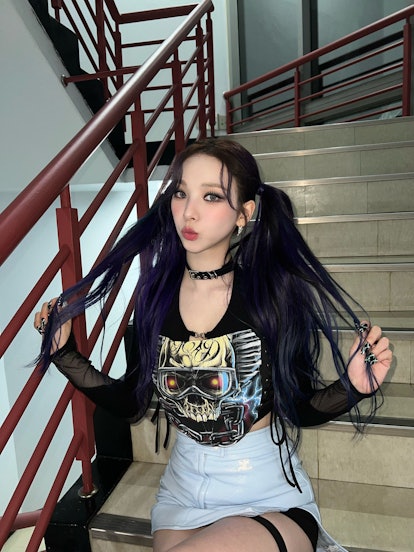 Girl with pigtails and goth-inspired eye makeup 