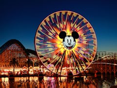 Mickey's Fun Wheel and the California Screamin' roller coaster are seen at dusk at Disney California...